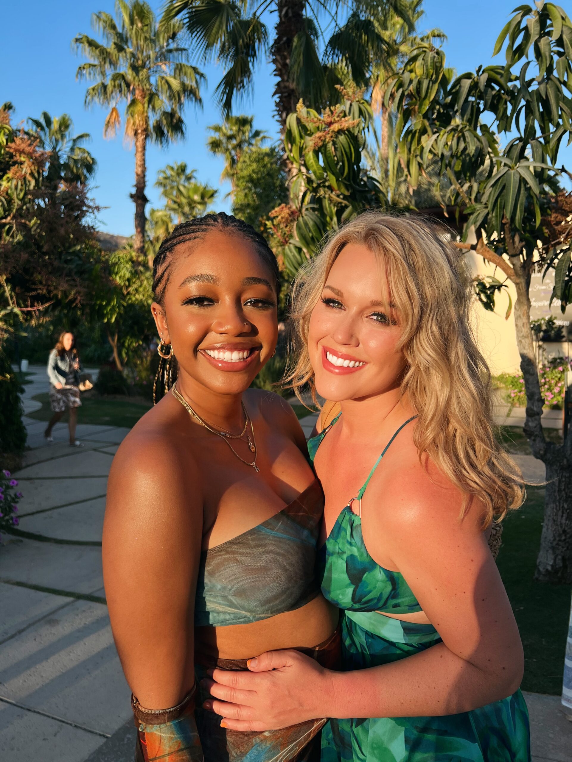Two women smiling in the sun at Flora Farms 