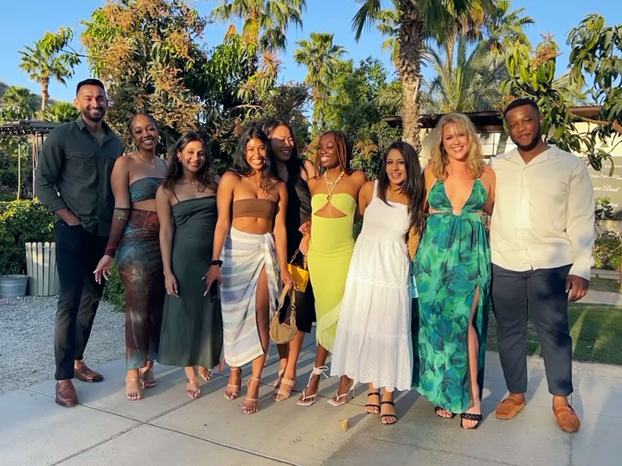 Group of friends smiling outside of Flora Farms 